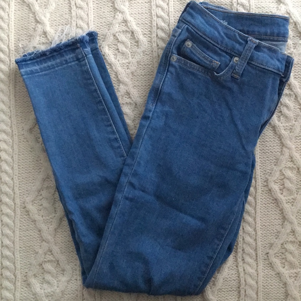 GAP mid wash denim jeans with distressed hemline